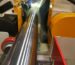 Coolant applied at the grinding zone of a cylindrical workpiece