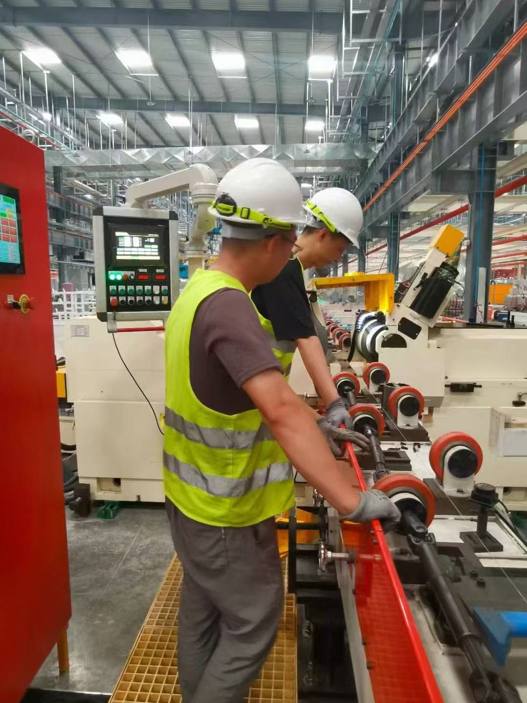Operator reviewing the control panel during on-site grinding training